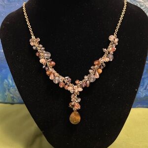 Avon gold-tone Y-necklace featuring multi-colored beads and a drop pendant